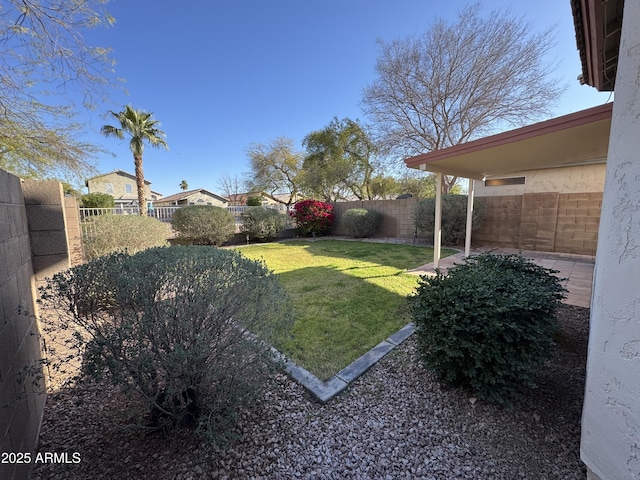 view of yard with a fenced backyard