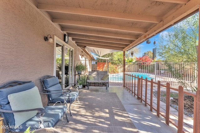 view of patio with a fenced in pool