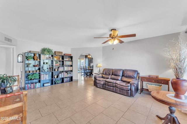 living room with ceiling fan and light tile patterned floors