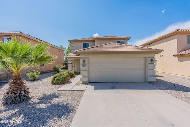 view of front of house with concrete driveway, an attached garage, a tile roof, and stucco siding