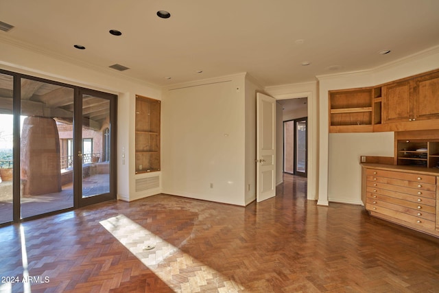 empty room featuring dark parquet flooring and ornamental molding