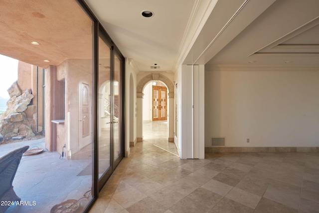 hallway featuring ornamental molding