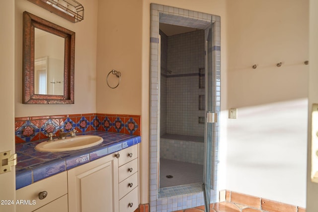 bathroom with vanity and walk in shower