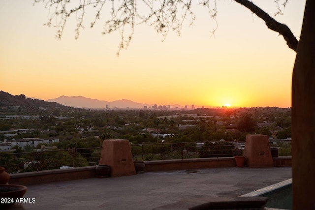 patio terrace at dusk with a mountain view