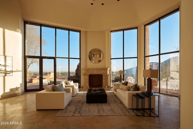 living room with a wealth of natural light and a high ceiling