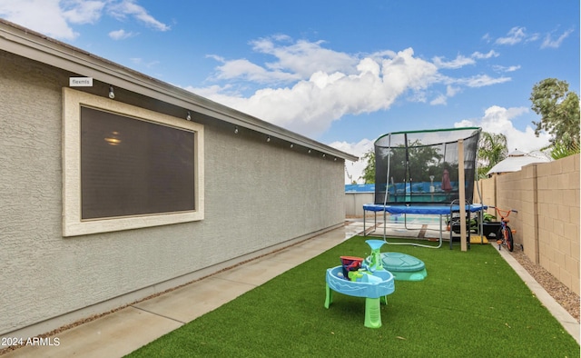 view of yard featuring a trampoline