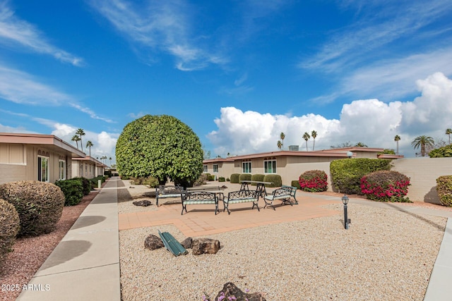 surrounding community with a patio area