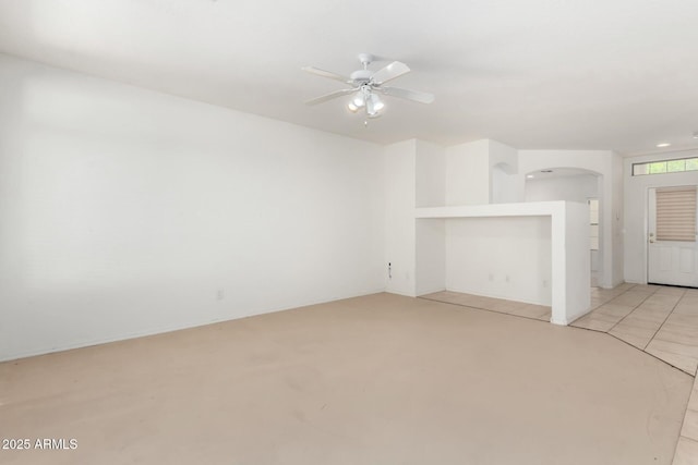 12726 W Charter Oak Rd, El Mirage, AZ 85335 - unfurnished living room featuring a ceiling fan and arched walkways