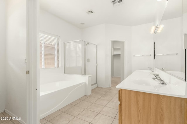 12726 W Charter Oak Rd, El Mirage, AZ 85335 - bathroom featuring a shower stall, visible vents, a garden tub, and a sink