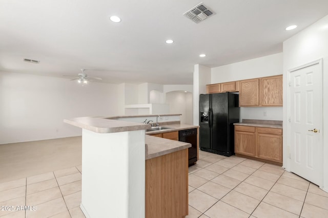 12726 W Charter Oak Rd, El Mirage, AZ 85335 - kitchen featuring visible vents, light tile patterned floors, a sink, and black appliances