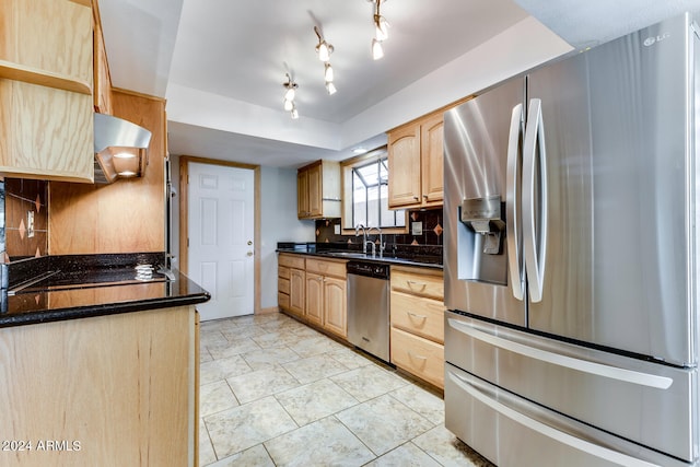 kitchen featuring sink, light brown cabinetry, backsplash, and stainless steel appliances