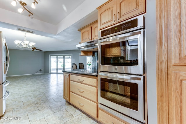 kitchen featuring decorative light fixtures, an inviting chandelier, light brown cabinetry, appliances with stainless steel finishes, and rail lighting