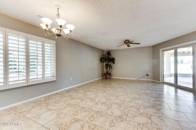 spare room with ceiling fan with notable chandelier and a textured ceiling