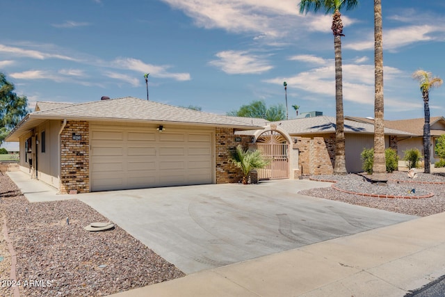 ranch-style house featuring a garage