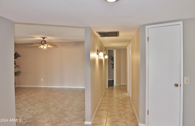 corridor featuring light tile patterned flooring