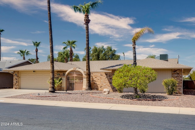 ranch-style home featuring a garage