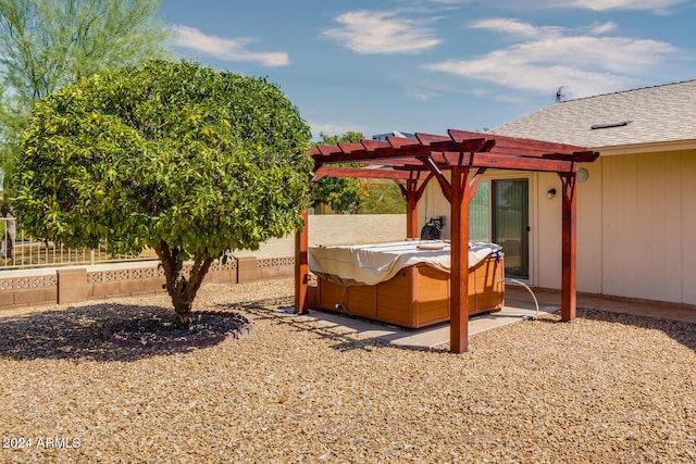 view of yard with a pergola and a hot tub