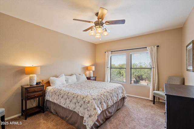 19700 N 76th St Unit 2089, Scottsdale, AZ 85255 - bedroom with a ceiling fan, baseboards, and light carpet