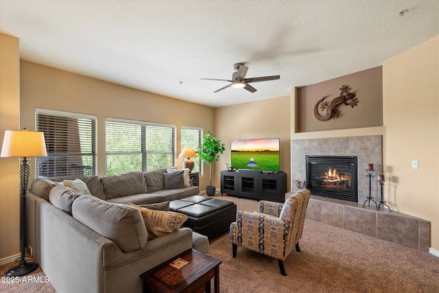 19700 N 76th St Unit 2089, Scottsdale, AZ 85255 - living area with a tile fireplace, carpet flooring, baseboards, and a ceiling fan