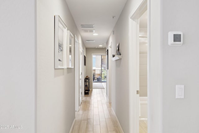 17850 N 68th St Unit 2138, Phoenix, AZ 85054 - hallway featuring baseboards and light wood-type flooring