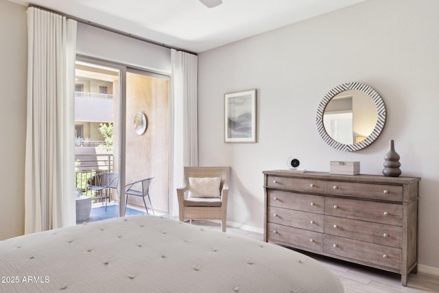 17850 N 68th St Unit 2138, Phoenix, AZ 85054 - bedroom with access to outside, baseboards, and light wood finished floors