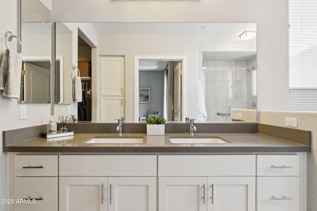 17850 N 68th St Unit 2138, Phoenix, AZ 85054 - full bath featuring double vanity, tiled shower, and a walk in closet
