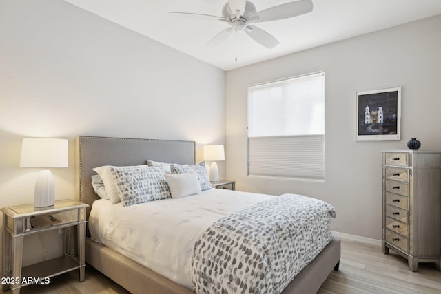 17850 N 68th St Unit 2138, Phoenix, AZ 85054 - bedroom featuring wood finished floors, baseboards, and ceiling fan
