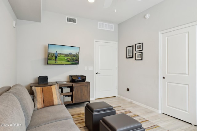 17850 N 68th St Unit 2138, Phoenix, AZ 85054 - living area featuring a ceiling fan, light wood finished floors, and baseboards