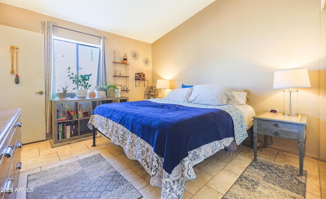 bedroom featuring lofted ceiling