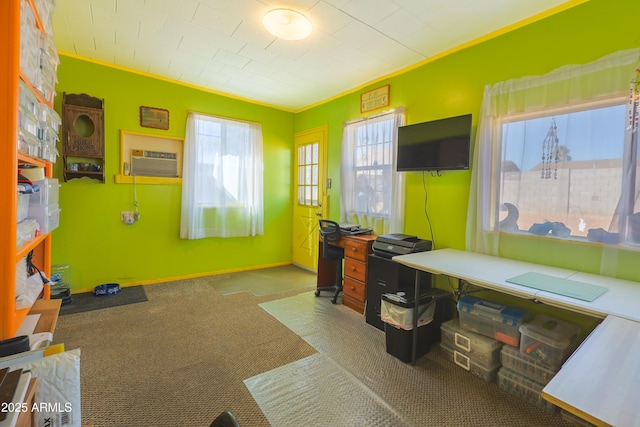 home office with ornamental molding and an AC wall unit