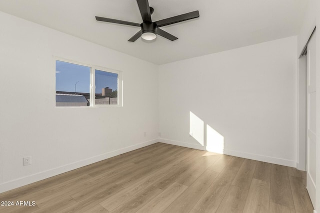 unfurnished room featuring light hardwood / wood-style flooring and ceiling fan