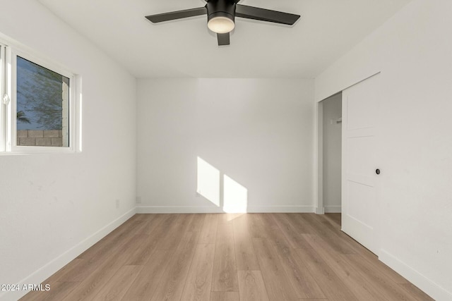 spare room featuring light hardwood / wood-style floors and ceiling fan