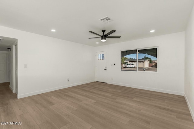 unfurnished room with ceiling fan and light hardwood / wood-style floors