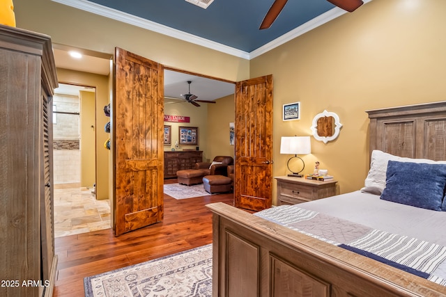 bedroom with light wood-style floors, ceiling fan, and ornamental molding