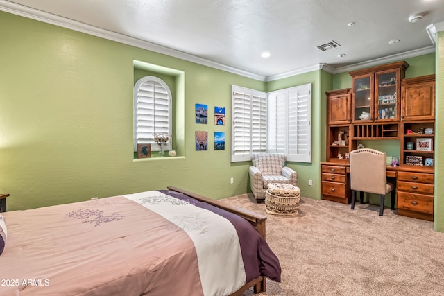 bedroom featuring light carpet, visible vents, ornamental molding, and a textured wall