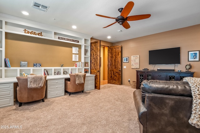 office space with light carpet, visible vents, a ceiling fan, built in study area, and recessed lighting