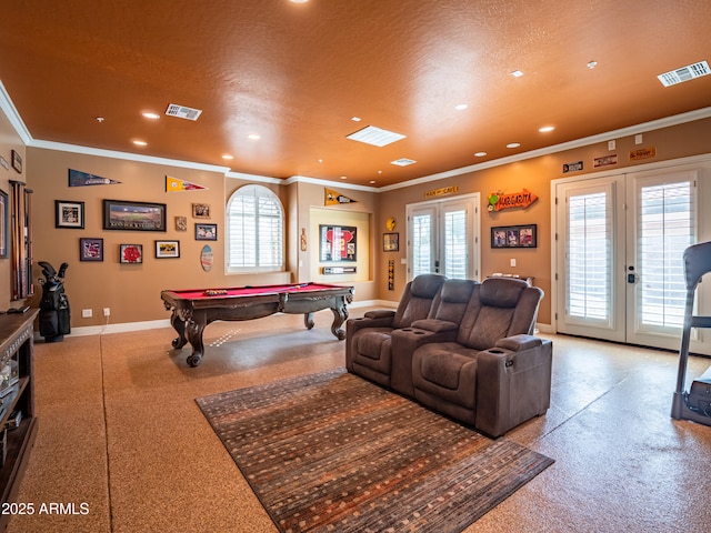 playroom featuring baseboards, visible vents, a textured ceiling, and french doors