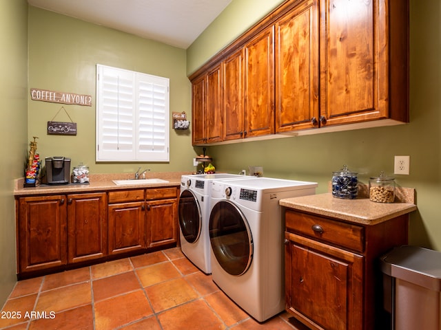 clothes washing area featuring washer and dryer, cabinet space, a sink, and light tile patterned flooring