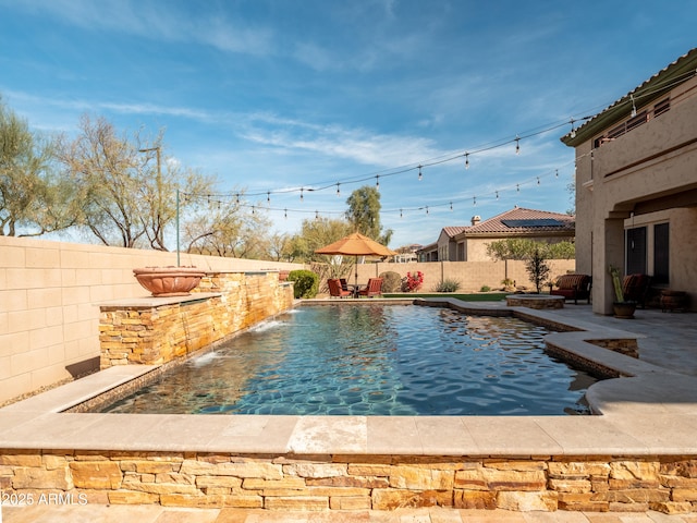 view of pool featuring a fenced backyard and a fenced in pool