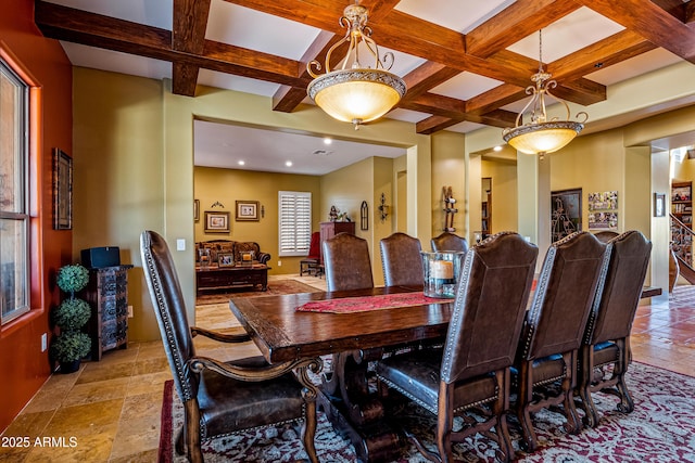 dining room featuring beamed ceiling, coffered ceiling, and stone tile floors