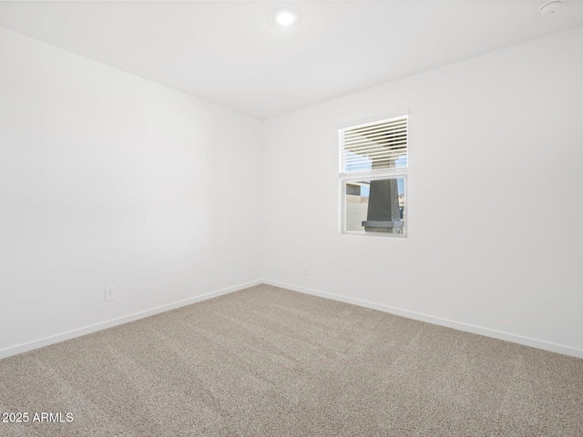 empty room with carpet, baseboards, and recessed lighting