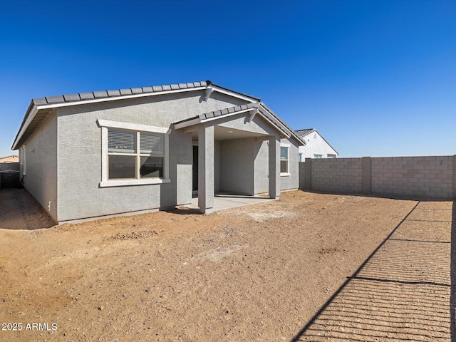 back of property featuring a patio area, a fenced backyard, and stucco siding