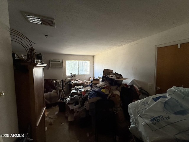 2030 N 21st Pl, Phoenix, AZ 85006 - carpeted bedroom with a wall mounted air conditioner and a textured ceiling