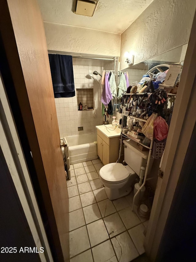 2030 N 21st Pl, Phoenix, AZ 85006 - full bath featuring a textured wall, vanity, tile patterned flooring, shower / washtub combination, and a textured ceiling