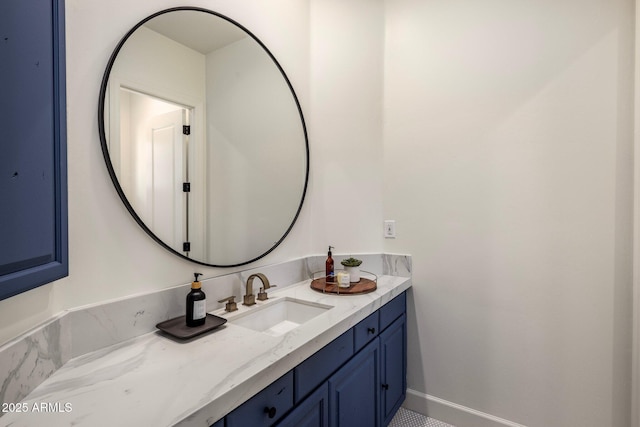 bathroom featuring baseboards and vanity