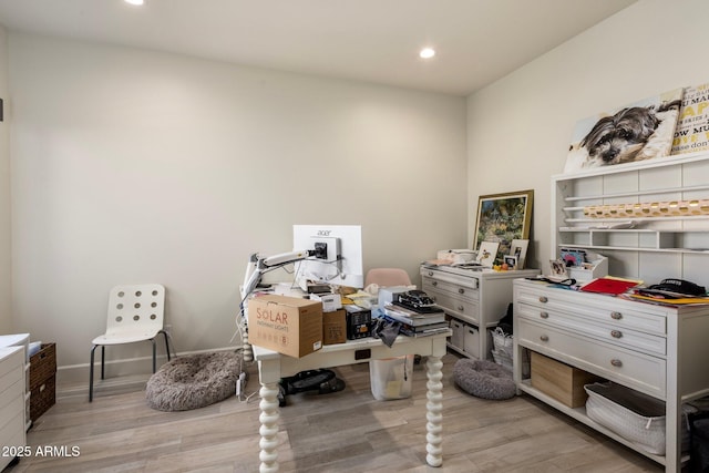 office space featuring baseboards, light wood finished floors, and recessed lighting