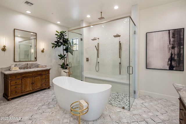 bathroom with a soaking tub, a shower stall, visible vents, and vanity