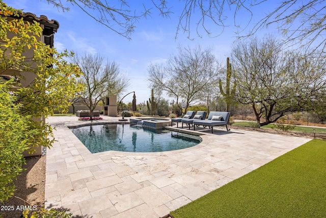 view of pool with a pool with connected hot tub, outdoor lounge area, and a patio