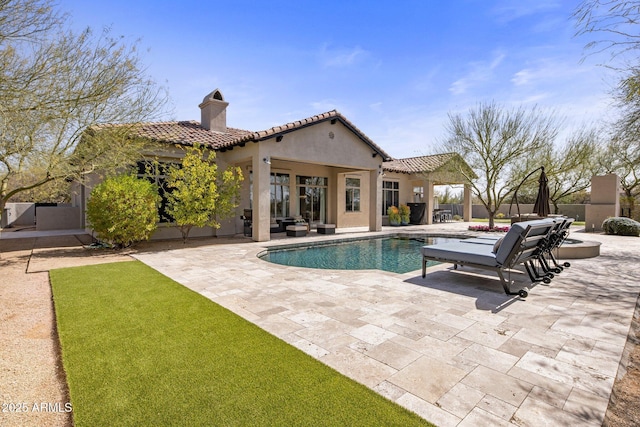 view of pool featuring a patio area, fence, and a fenced in pool