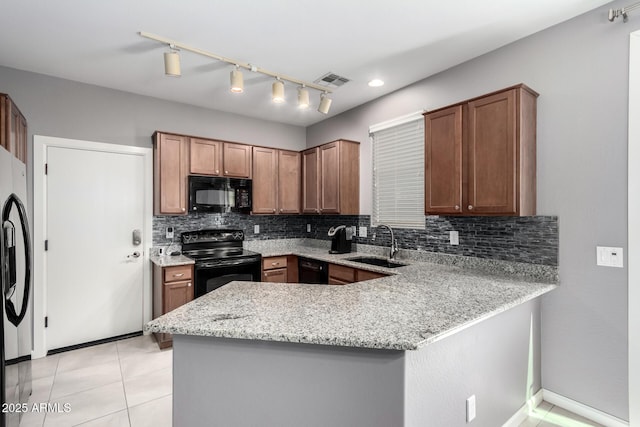 4043 E Carla Vista Dr, Gilbert, AZ 85295 - kitchen with black appliances, a sink, a peninsula, decorative backsplash, and light stone countertops